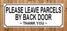 PLEASE LEAVE PARCELS BY BACK