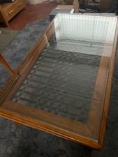 Large glass top Moroccan style wooden coffee table with iron fretwork 