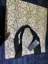 A COOL ANIMAL SKIN CARRIER BAG