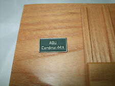 ABU CARDINAL 44X SIDE PLATE BADGE