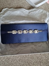 Navy blue satin clutch bag with long metal strap from pink, wedding