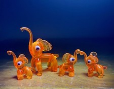 Vintage orange Murano Glass Lampwork Elephant Family UV Reactive Cadmium Glow. 
