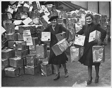Women carrying petrol cans