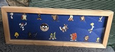 Framed collection of 18 Looney Tunes   Metal Enamel Pin Badges Warner Bros