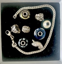Trollbeads Bracelet with 8 collectible trollbeads charms 