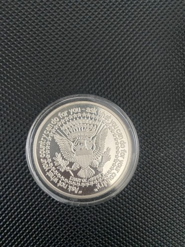 Three kennedys silver coin - three,