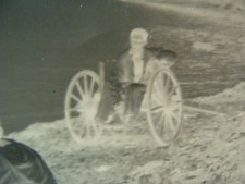 ANTIQUE -- at beach in wheel