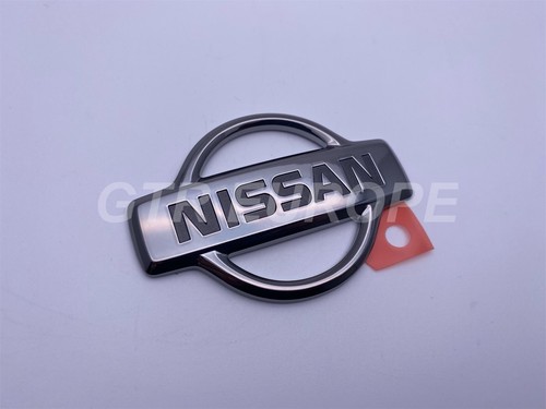 Genuine rear trunk emblem - rear,