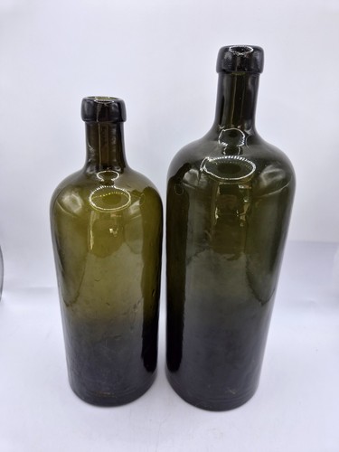 Two olive green - green, bottles