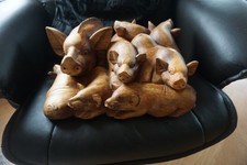 FOLK ART CARVED GROUP OF PIGS