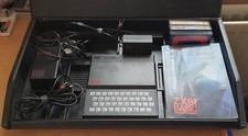 Sinclair ZX81 computer with games, 80s era carry case, original cables and PSU