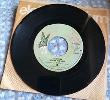 Lee Oskar - Before The Rain 7" Record (Belize City Sellers Stamp)
