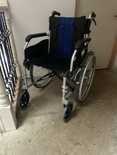 nearly new blue and black wheelchair with missing foot pedals