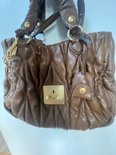 Brand miu - miu, well