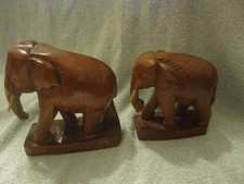 2 wooden hand carved elephants. 130mm & 110mm high.  Wooden tusks. Varnished