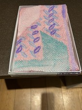 A Japanese silk scarf in its original box