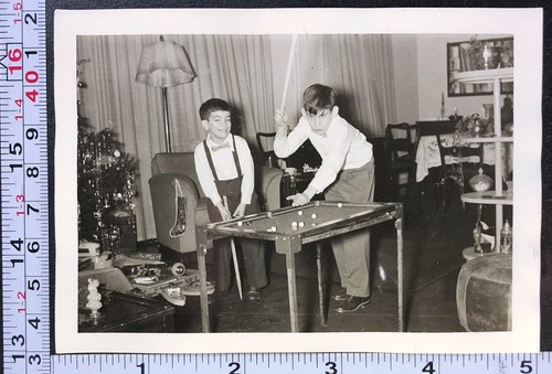 Two children shooting pool - two,