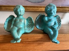 A Pair of Green & Gold Cherub Shelf Sitting Ornaments