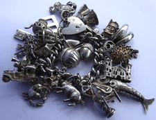 Vintage 101.8g solid silver charm bracelet & multiple curious charms inc moving