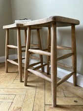 A Matching Pair Of Weathered Lab Stools 