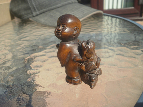 Carved wood netsuke boy