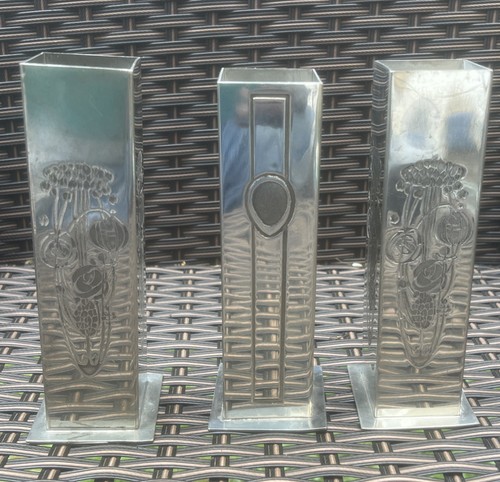 Vintage pewter vases feature
