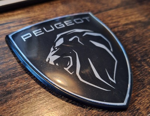 Black and silver - peugeot, badge