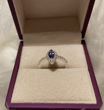 New AAA Tanzanite and Cambodian Zircon ring, size N or O.