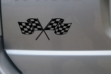 Crossed chequered racing flags