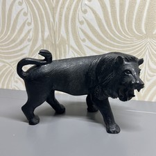Hand carved black wood lion