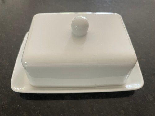 White ceramic butter dish with - butter,