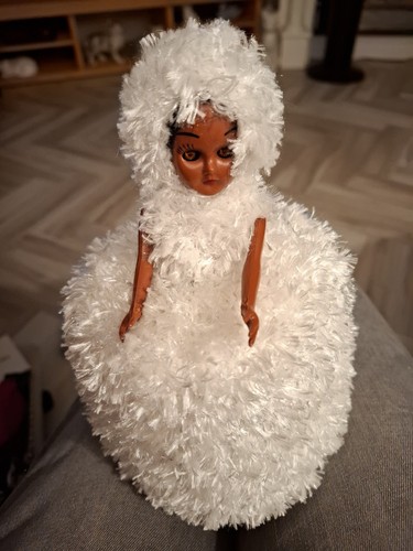 Retro hand knitted toilet roll - hand,
