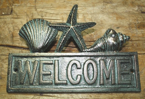 Cast iron seashell welcome - cast,