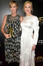 Two Women Standing Next To