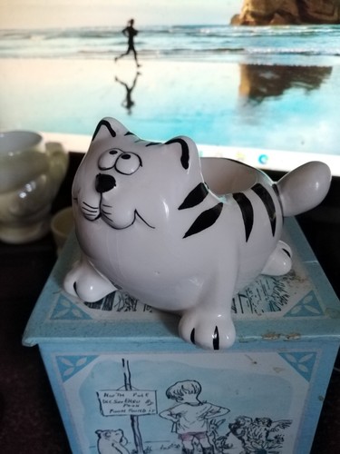 Novelty egg cups featuring - -,
