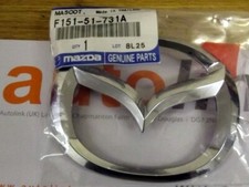 Front wings bonnet badge