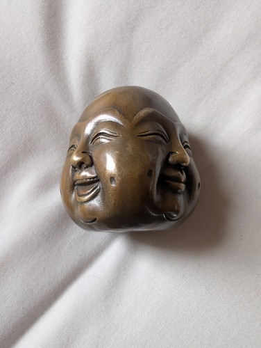 Vintage solid brass four faces - four,