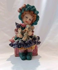 Little Girl Sitting On A Pink