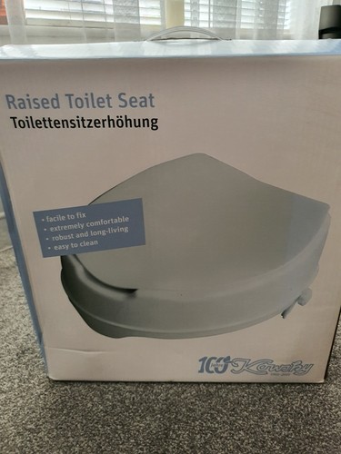Raised toilet seat with lid