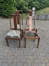 Set of four mahogany queen anne style dining chairs with floral pattern cushions