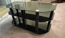 Glass TV Stand In Excellent Condition 100cm x 40cm. Toughened Black Glass Unit