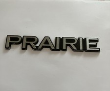 Nissan Prairie Badge Logo