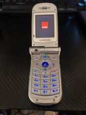 samsung v200 mobile phone metalic silver on orange