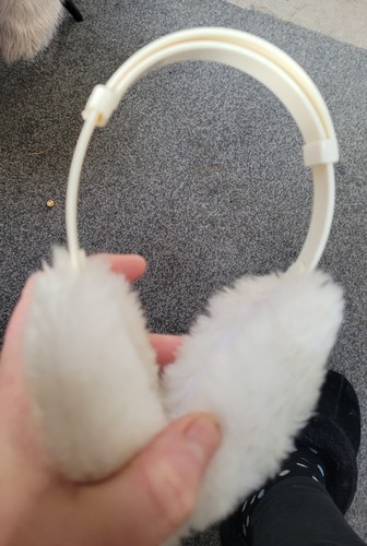 Pair fluffy white ear - ear, muffs
