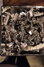 Box of kitchen cupboard hinges, about 24