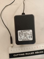 AC Adaptor 12v 1000mA P/N 13051F Model No. 12100BS 230v 50Hz 110mA
