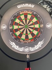 Dart board , stand , light surround & darts (with case)