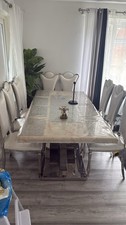 Marble dinning room table with leather chairs