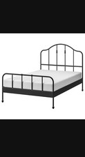 Black metal bed with mattress