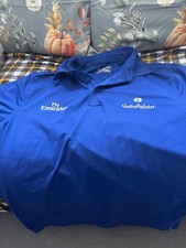 Godolphin issued Lightweight polo shirt by Under Armour. Size is small medium.